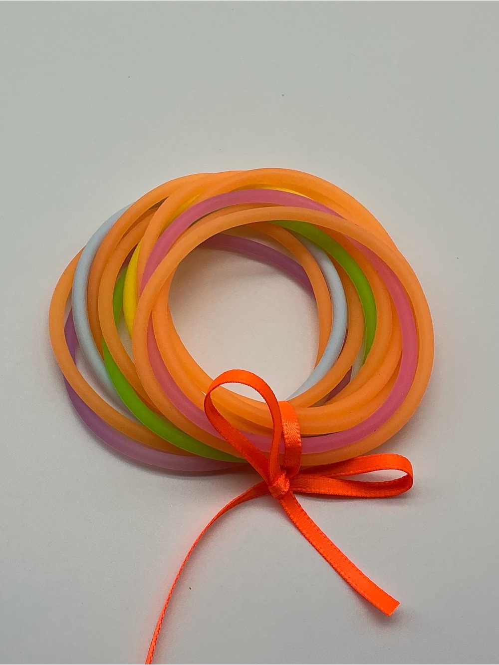 Set of 12 Neon Orange and Pastel Rainbow Colored Jelly Bracelets